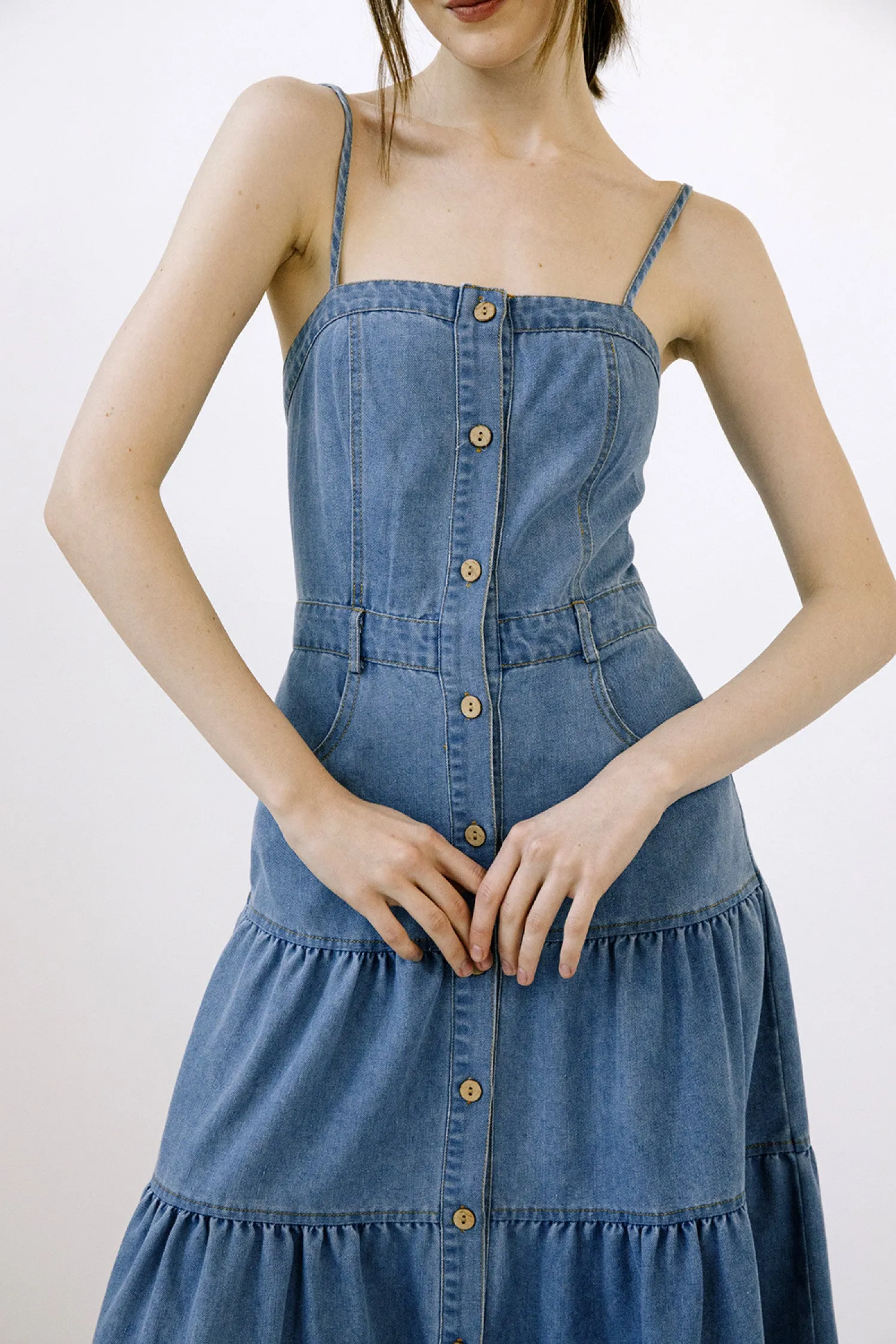 Certainly! To optimize the title of an e-commerce product like the Ashton Denim Dress, we can add modifiers to highlight key features and benefits that might attract more customers. Heres an optimized version:

Ashton Womens Casual Denim Dress with Short Sleeves and Front Pockets

This title includes:

1. **Target Audience**: Womens specifies who the dress is for.
2. **Style/Occasion**: Casual suggests the intended use or style of the dress.
3. **Material**: Denim highlights the material, which is often a selling point.
4. **Design Features**: Short Sleeves and Front Pockets provide additional details that shoppers might be looking for.

This optimized title provides more information and can draw in potential buyers by addressing specific preferences and needs.